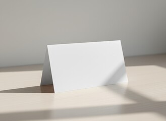 Blank white tent card mockup with soft natural shadows