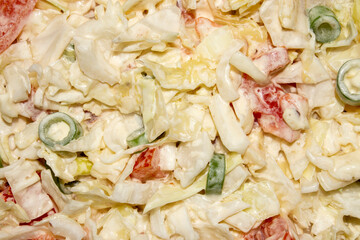 Salad of fresh cabbage with onions and tomatoes.Vegetable diet salad.Cabbage with mayonnaise.White cabbage salad.