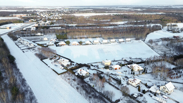 Frozen suburban area with rooftops and trees