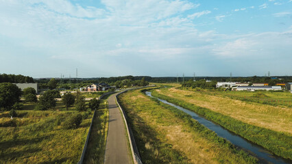 Drone photo of trail next to quiet river