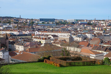 A high-quality cityscape of downtown &Eacute;pinal, located in the Vosges region of northeastern France. The image showcases the harmonious blend of historic French architecture, modern urban elements