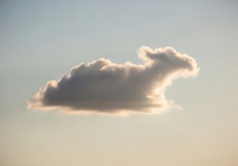 A cloud in the shape of a llama floats in the sky during daytime