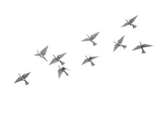Origami birds flying in a flock of paper birds