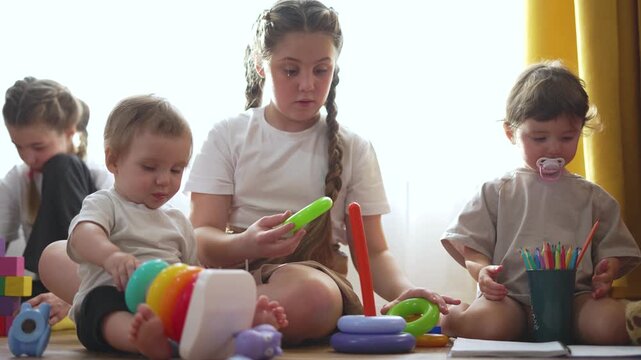 kindergarten children play educational games with pleasure air is filled with laughter. fun kindergarten children participate educational games. kindergarten scene children immersed educational games.
