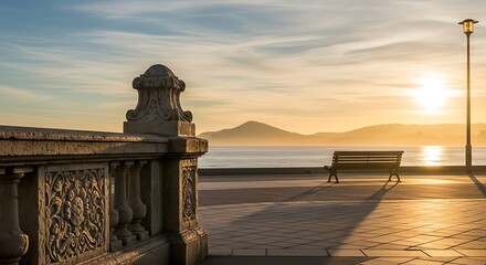 Fototapeta premium Bench on the promenade at sunrise in san sebastian