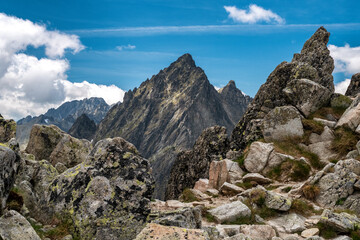 Rocky foreground framing the jagged High Tatras peaks above Mala Studena Dolina, scenic alpine view from Lomnicke sedlo in Slovakia