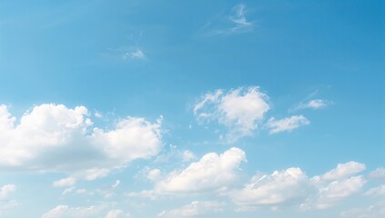 Fototapeta premium Soft white clouds against a blue sky, suitable for UI backdrop