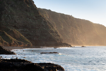 Golden hour over cliffs and coastline at Playa de la Arena, north Tenerife, Canary Islands