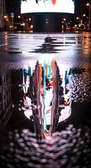 A vibrant city street scene at night with reflections on the wet pavement and illuminated billboards creating a colorful and lively atmosphere