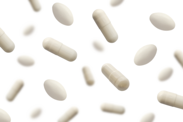 Falling white medicine pills capsule isolated on white background