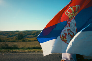 Serbian flag with nature in background. 