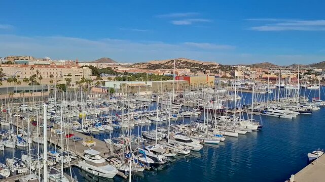 spain marcia jan 4 2024 Marina Full of Sailboats in a Coastal City Harbor Under Bright Blue Sky