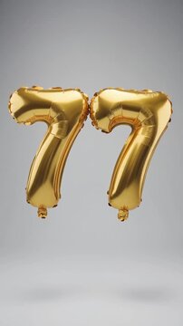 Gold balloon number 77 for birthday or anniversary party