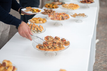 Elegant Private Event Featuring a Lavish Buffet Spread with Diverse Culinary Delights and Guests Enjoying the Festivities