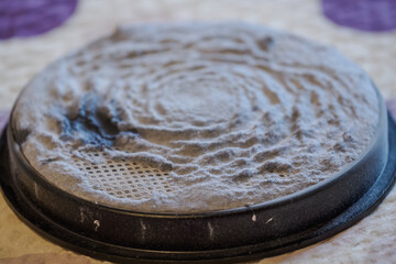 Clogged HEPA filter with dust after long use of a vacuum cleaner without cleaning.
