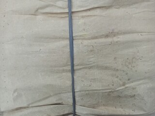 Old Brown Wrinkled Paper Wrapped Parcel Tied String