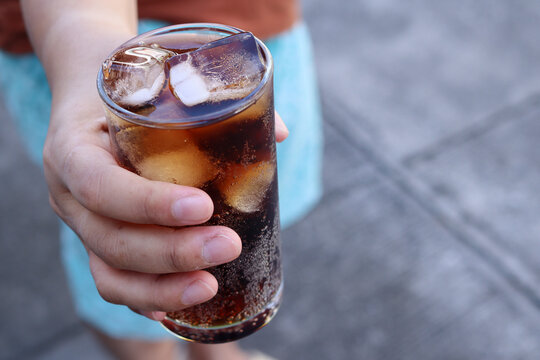 Soft drink cola iced on hand