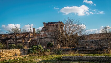 Ancient city ruins under a blue sky, highlighting architectural history