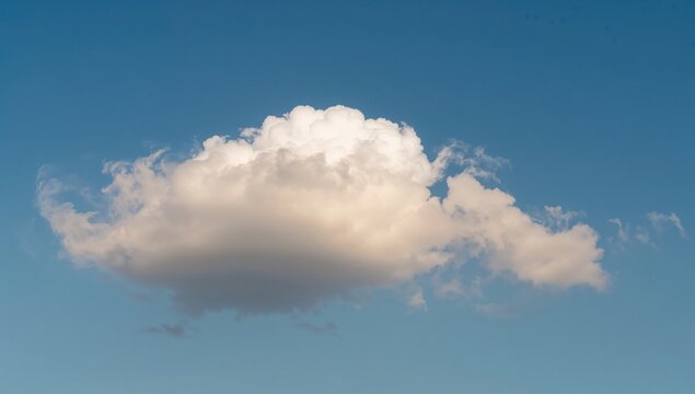 Fluffy white cloud against a bright blue sky, ideal backdrop for text layout