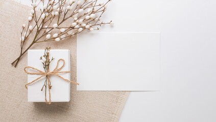 Blank greeting card mockup featuring a present and fresh twigs, ideal for personalized messages