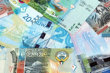 Kuwaiti dinar currency money bills. The current banknotes lies on table in big amount close up
