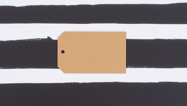 Brown gift tag on monochrome striped background, ideal for personalized notes