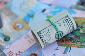 Kuwaiti dinar currency money bills and bunch of us dollar banknotes close up. The concept of...