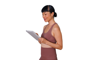 Confident corporate woman with curly hair typing on a notebook computer, managing business tasks, and communicating online