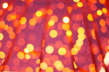 Abstract background of bokeh holiday garlands and lamps.