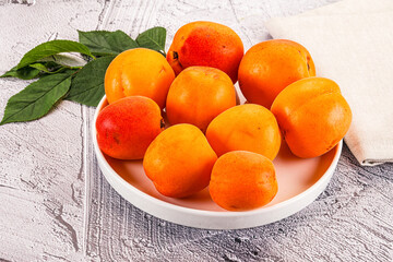 Raw ripe sweet apricots heap