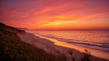 Obraz premium Watching the sunset over the beach, serene natural landscape with evening light, seasonal change