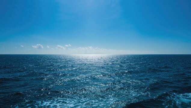 The vast blue ocean under a clear sky, a serene backdrop for relaxation and travel