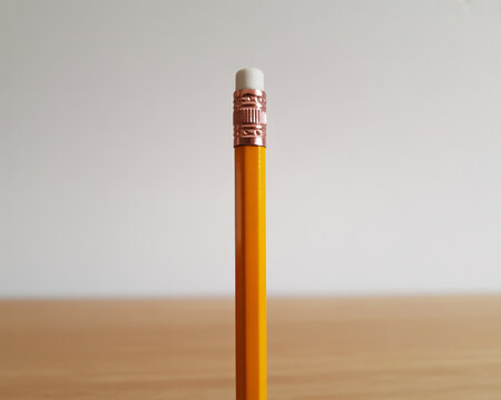 Bright yellow pencil ready for creative writing and drawing projects, perfect for back to school advertisements or educational material designs