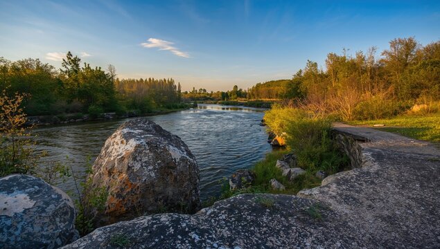 Scenic rocks along a riverbank, highlighting natural erosion risk