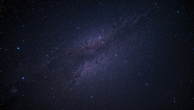 Star-filled night sky with nebulous formations, a backdrop for stargazing and astrophotography