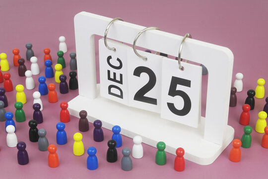 December, 25 on calendar and many people figures on purple background.
