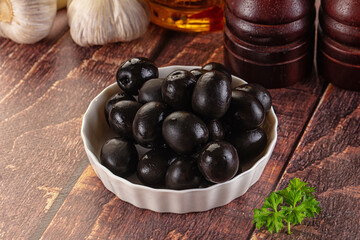Mediterranean marinated Black olives in the bowl