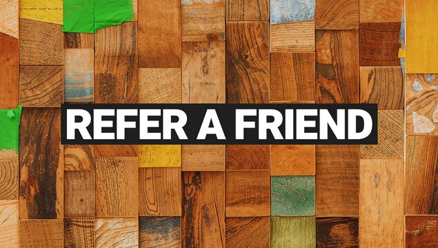 Wooden blocks spelling out REFER A FRIEND, potential for team collaboration