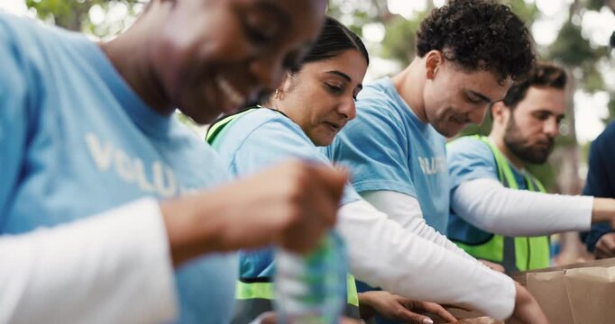 NGO, food drive and volunteers with boxes outdoor for nonprofit, charity or community outreach. Groceries, helping and group of people with parcels for donation with social responsibility in park.