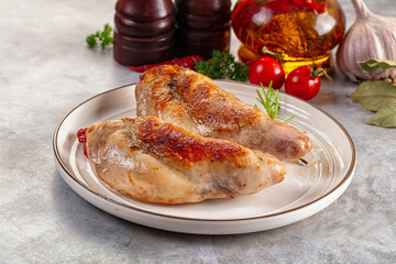 Roasted rabbit leg served rosemary