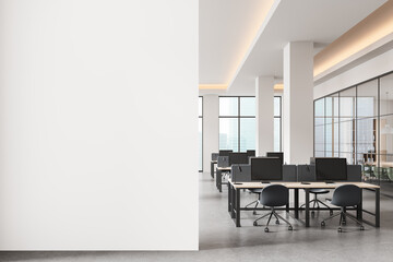 Empty white wall mockup in modern open space office with bright interior and computer desks, perfect for poster or banner design presentation template. 3D Rendering