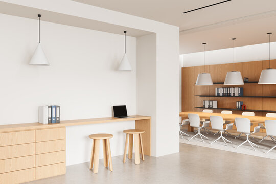 Modern minimalist office interior design with light wood furniture, pendant lighting and neutral palette in open collaborative workspace. 3D Rendering