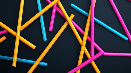 Colorful plastic straws scattered on a dark surface, showcasing vibrant hues of pink, blue, and yellow in a playful arrangement.