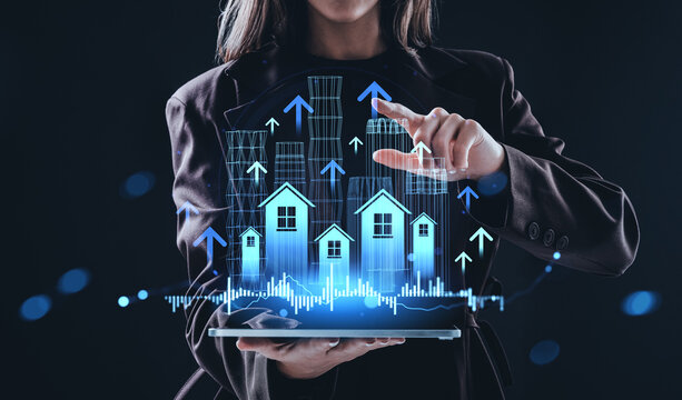 Woman using tablet with digital real estate and property market - Powered by Adobe