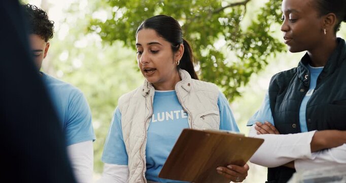 Volunteers, donations and people with clipboard, park and listen to organizer for community service. Outdoor, group and coordinator with checklist for inventory, discussion and supply distribution