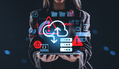 Businesswoman holding tablet with cloud storage error warning ic