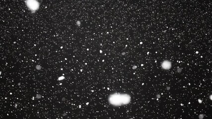 black background snow particles falling night, cinematic monochrome closeup of soft bokeh flakes drifting through cold air, slow - Powered by Adobe