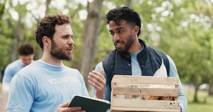 Volunteer, discussion or men in nature with tablet, bokeh or package checklist in eco friendly project. Team, coordination or NGO in park with tech, inventory track or guidance in charity donation.