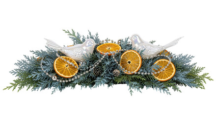 Isolated evergreen centerpiece with dried orange slices and ceramic birds for the holidays