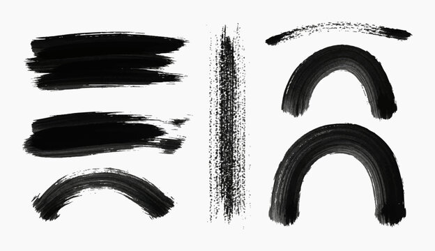 Collection of abstract black brush strokes and arched shapes on a white background